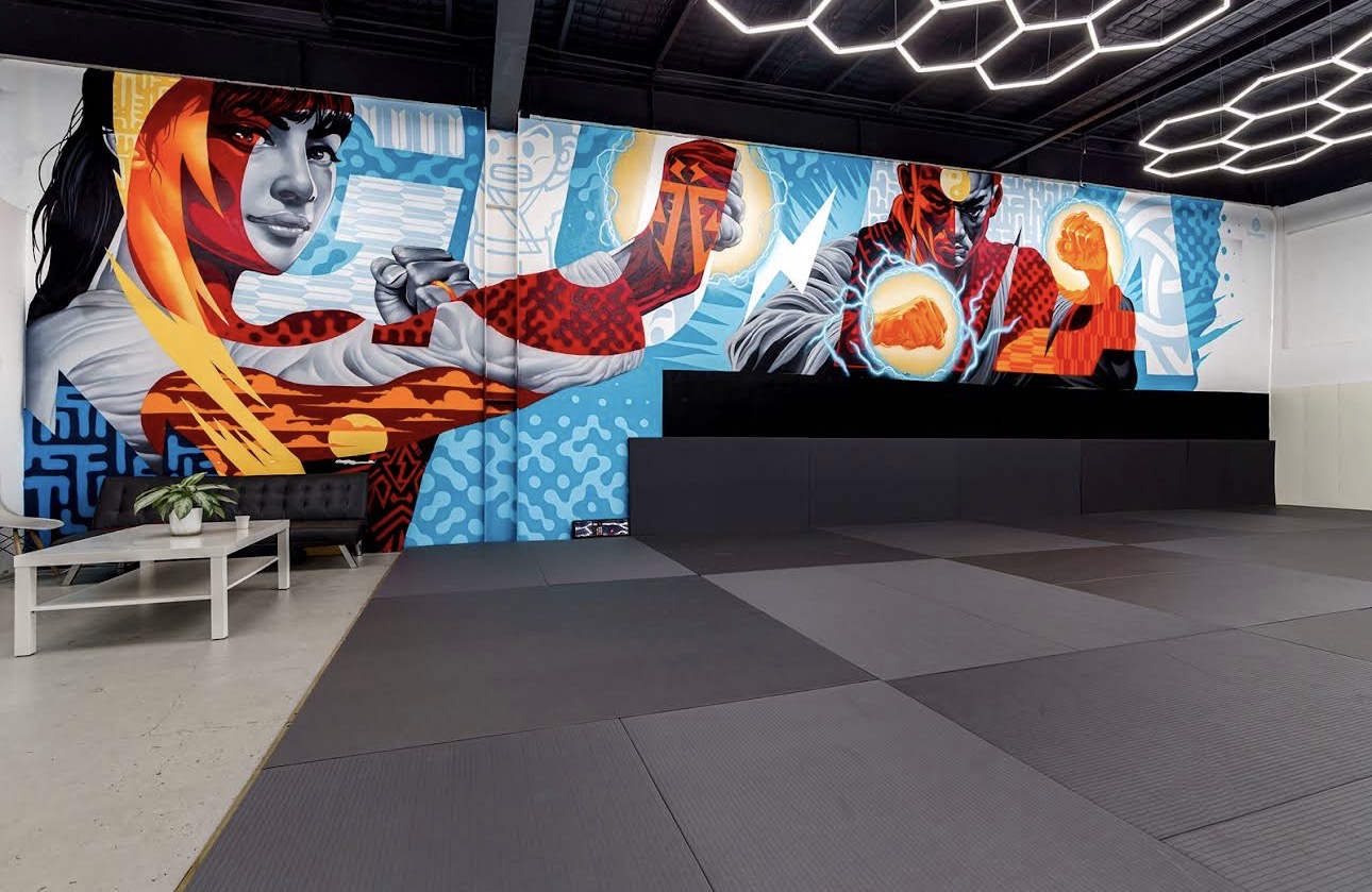 Close-up of the academy's energy-fist mural