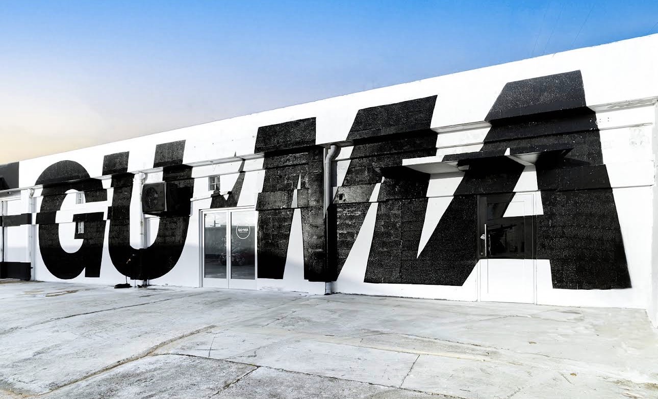Guam Martial Arts Academy exterior with the GUMA mural
